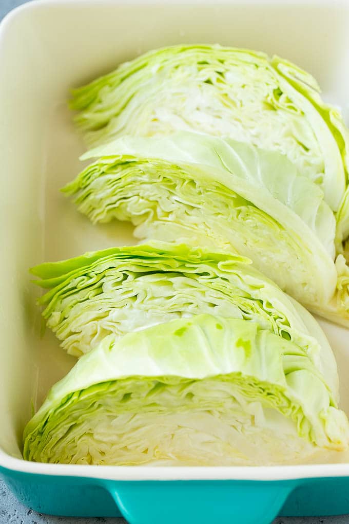 Braised Cabbage Recipe | Easy Cabbage Recipe #cabbage #lowcarb #keto #carrots #veggies #vegetarian #dinner #uzhal Wedges of cabbage in a baking dish.