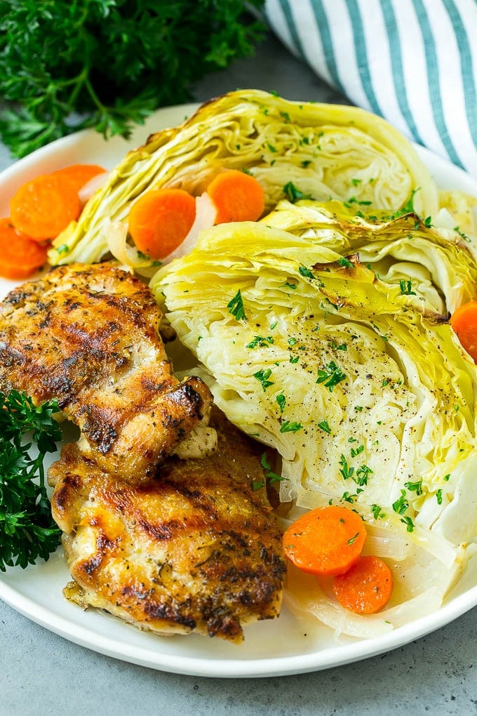Braised Cabbage Recipe | Easy Cabbage Recipe #cabbage #lowcarb #keto #carrots #veggies #vegetarian #dinner #uzhal A plate of grilled chicken along with braised cabbage, carrots and onions.