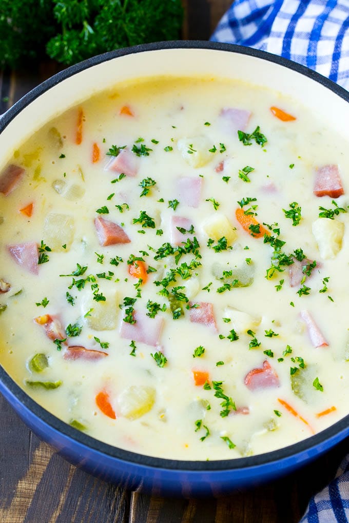 Ham and Potato Soup | Ham Soup | Potato Soup #soup #ham #potato #dinner #comfortfood #uzhal A pot of ham and potato soup with vegetables in a creamy broth, topped with parsley.