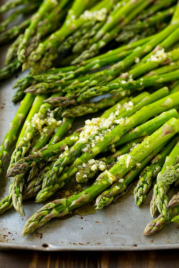 Roasted Asparagus Recipe | Baked Asparagus | Asparagus Side Dish #asparagus #garlic #sidedish #keto #lowcarb #dinner #uzhal Raw spears drizzled with olive oil, garlic, herbs, salt and pepper.
