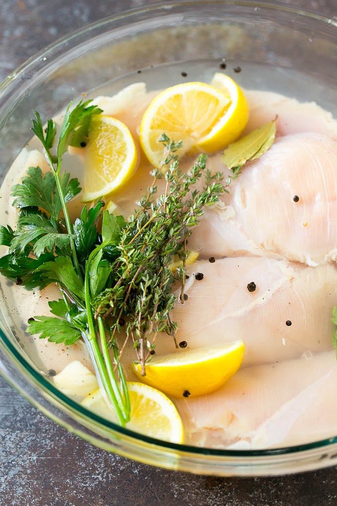Smoked Chicken Breast Recipe | BBQ Chicken | Smoked Chicken #bbq #chicken #smoker #dinner #glutenfree #uzhal Chicken breasts in a bowl of brine with lemon and herbs.