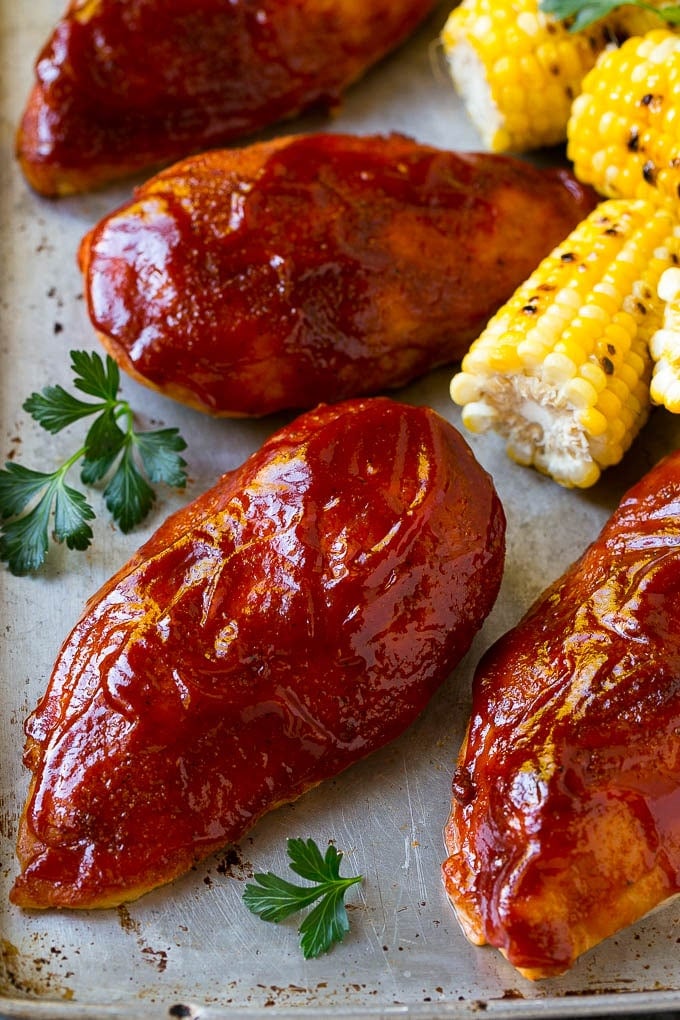 Smoked Chicken Breast Recipe | BBQ Chicken | Smoked Chicken #bbq #chicken #smoker #dinner #glutenfree #uzhal Smoked chicken breasts on a sheet pan with corn on the corn and fresh herbs.