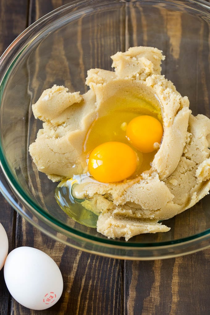 Eggnog Cookies Recipe | Holiday Cookies | Christmas Cookies #cookies #eggnog #baking #christmas #sprinkles #dessert #uzhal Butter, sugar and eggs in a mixing bowl.