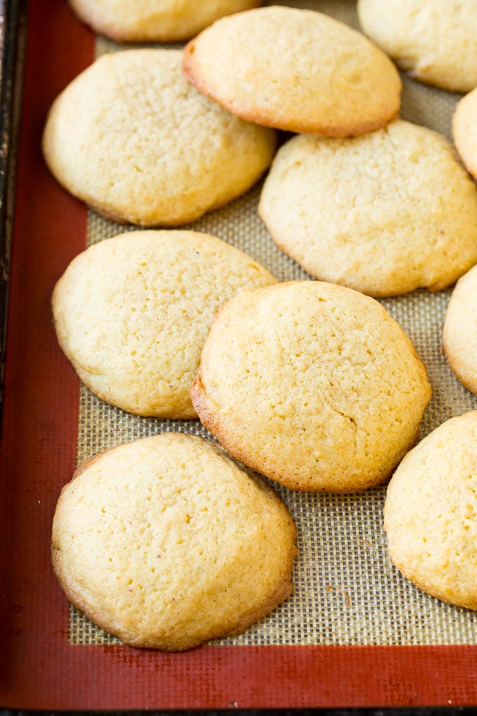Eggnog Cookies Recipe | Holiday Cookies | Christmas Cookies #cookies #eggnog #baking #christmas #sprinkles #dessert #uzhal Baked eggnog cookies on a sheet pan.