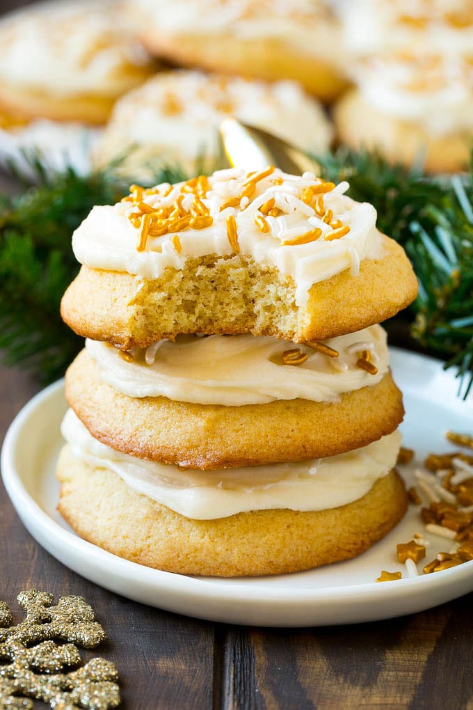 Eggnog Cookies Recipe | Holiday Cookies | Christmas Cookies #cookies #eggnog #baking #christmas #sprinkles #dessert #uzhal A stack of eggnog cookies with a bite taken out of one.