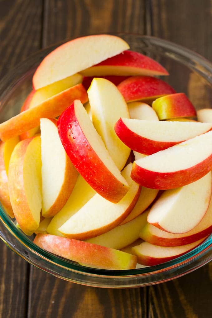 Fried Apples Recipe | Sauteed Apples | Cinnamon Sugar Apples #apples #cinnamon #sugar #sidedish #dessert #uzhal #fall Sliced apples in a mixing bowl.
