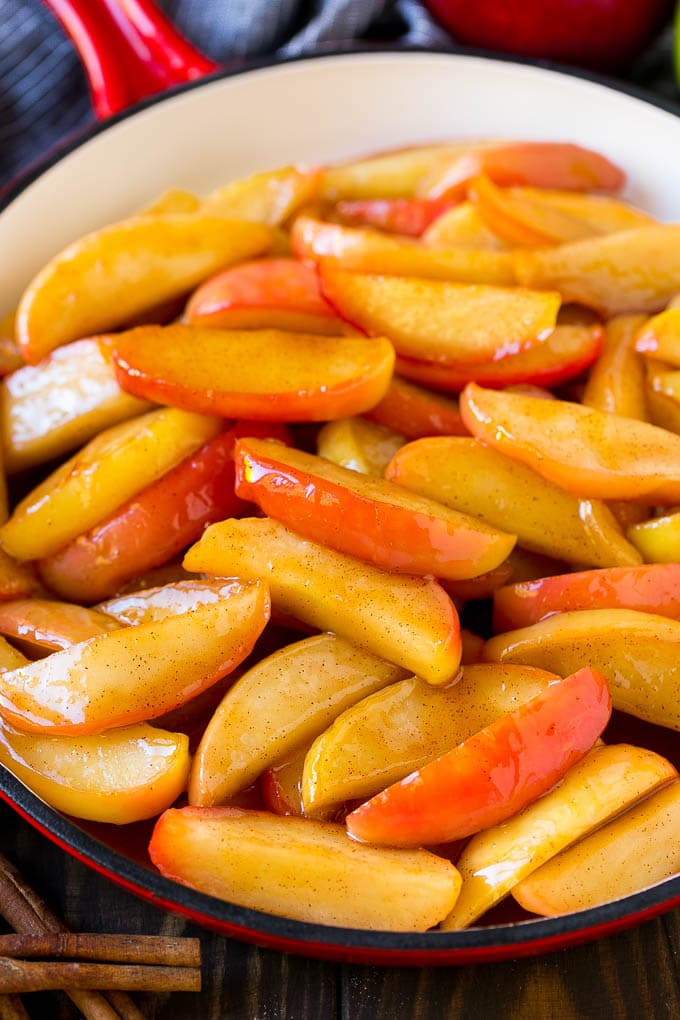 Fried Apples Recipe | Sauteed Apples | Cinnamon Sugar Apples #apples #cinnamon #sugar #sidedish #dessert #uzhal #fall Southern fried apples coated in butter, cinnamon and sugar in a red skillet.