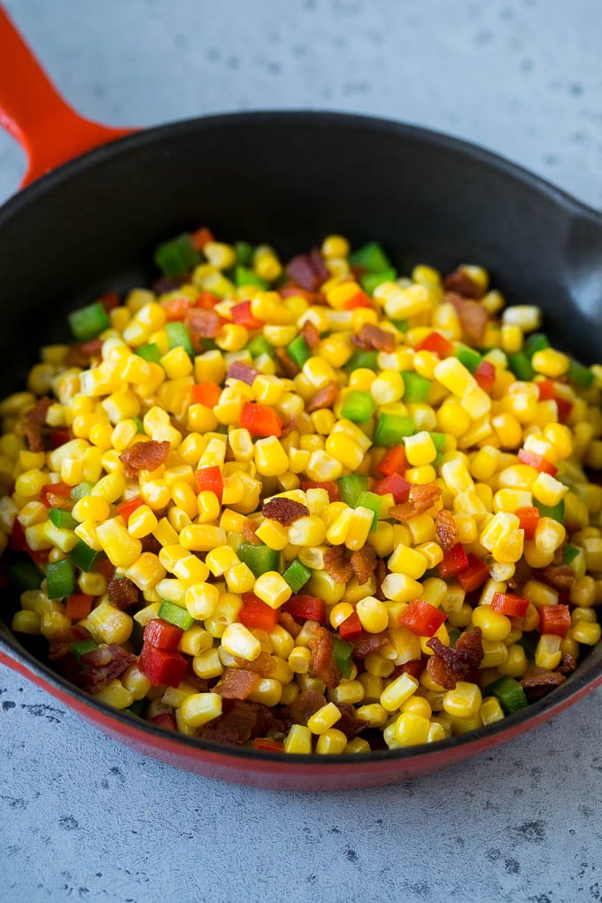 Corn Dip Recipe | Hot Cheese Dip | Bacon Dip #corn #dip #bacon #cheese #appetizer #snack #uzhal Corn, bacon and bell peppers in a skillet.