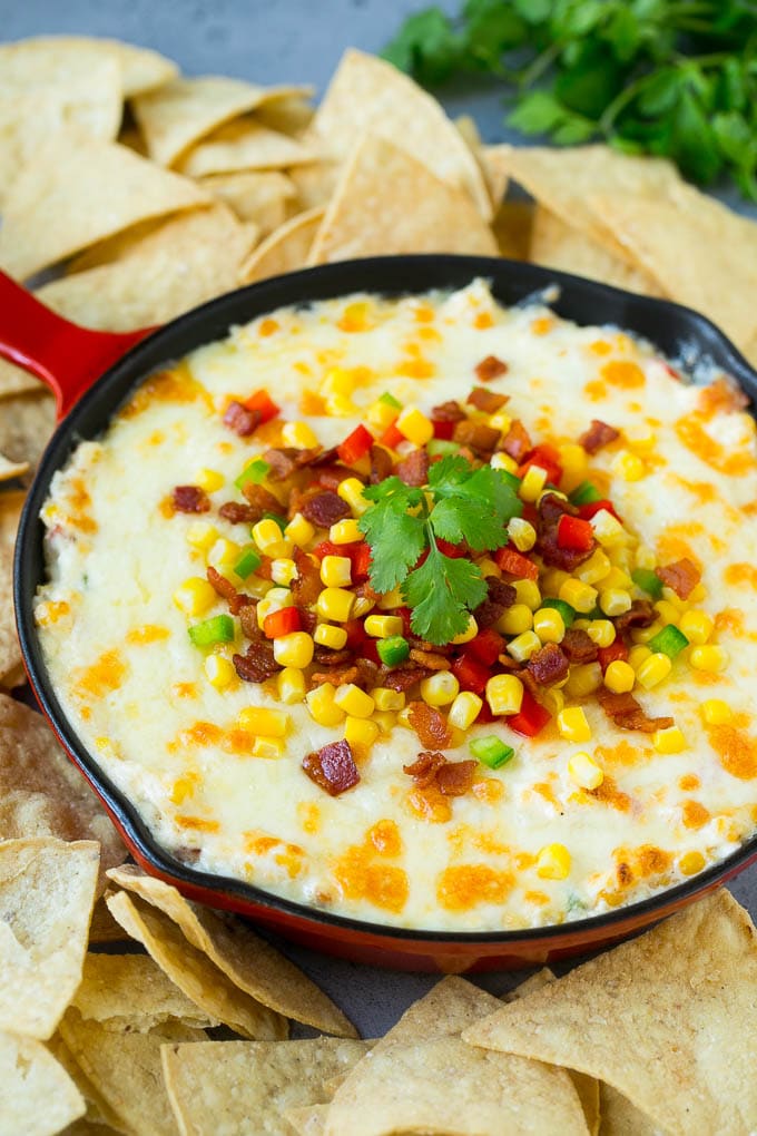 Corn Dip Recipe | Hot Cheese Dip | Bacon Dip #corn #dip #bacon #cheese #appetizer #snack #uzhal Hot corn dip made with two types of cheese, corn, peppers and bacon, served with tortilla chips.