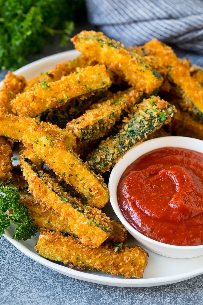 Fried Zucchini Recipe | Zucchini Fries | Zucchini Recipe #appetizer #zucchini #snack #uzhal A plate of fried zucchini served with marinara for dipping.