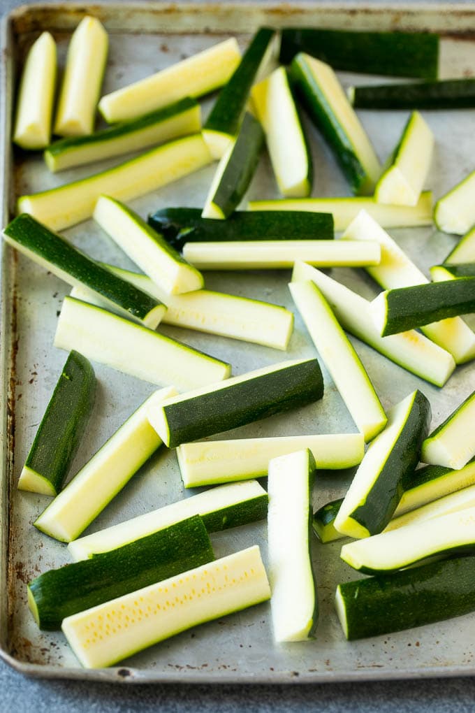 Fried Zucchini Recipe | Zucchini Fries | Zucchini Recipe #appetizer #zucchini #snack #uzhal Raw sticks on a sheet pan.