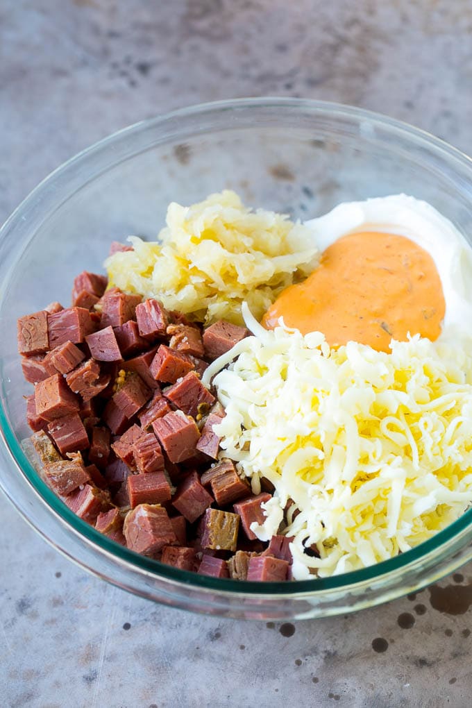 Reuben Dip Recipe | Corned Beef Dip | Cheese Dip #dip #cheese #cornedbeef #appetizer #lowcarb #keto #uzhal Corned beef, cream cheese, Thousand Island dressing and cheese in a bowl.