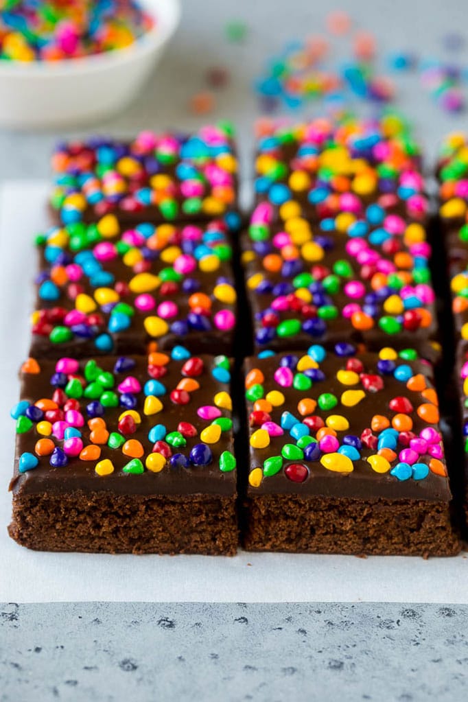 Cosmic Brownies Recipe | Cocoa Brownies | Frosted Brownies #brownies #chocolate #dessert #uzhal #sprinkles Cosmic brownies topped with chocolate fudge and crunchy rainbow sprinkles.