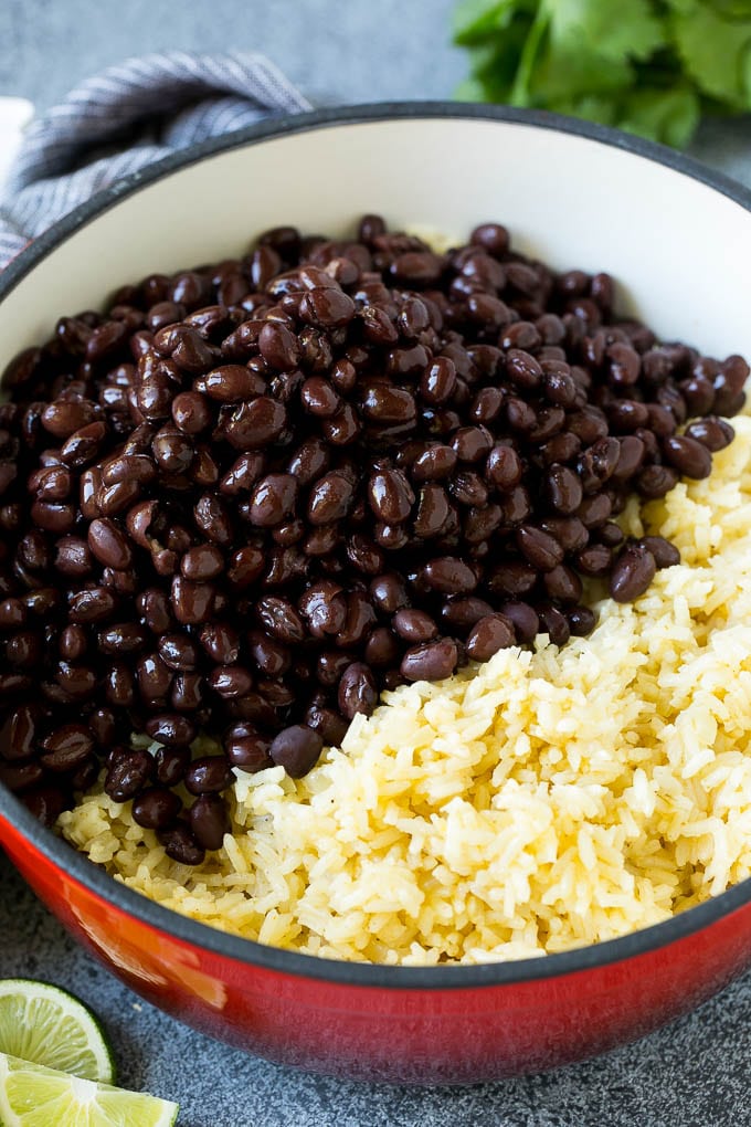 Black Beans and Rice Recipe | Cuban Black Beans | Beans and Rice #beans #rice #blackbeans #sidedish #glutenfree #dinner #uzhal Cooked rice and black beans in a pot.