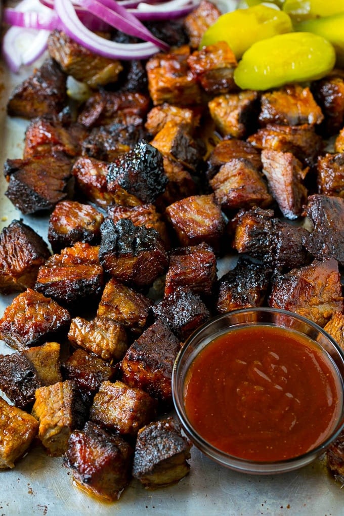 Burnt Ends Recipe | Smoked Brisket | Beef Brisket #brisket #bbq #smoker #beef #dinner #uzhal Burnt ends on a sheet pan served with BBQ sauce, red onions and pickles.