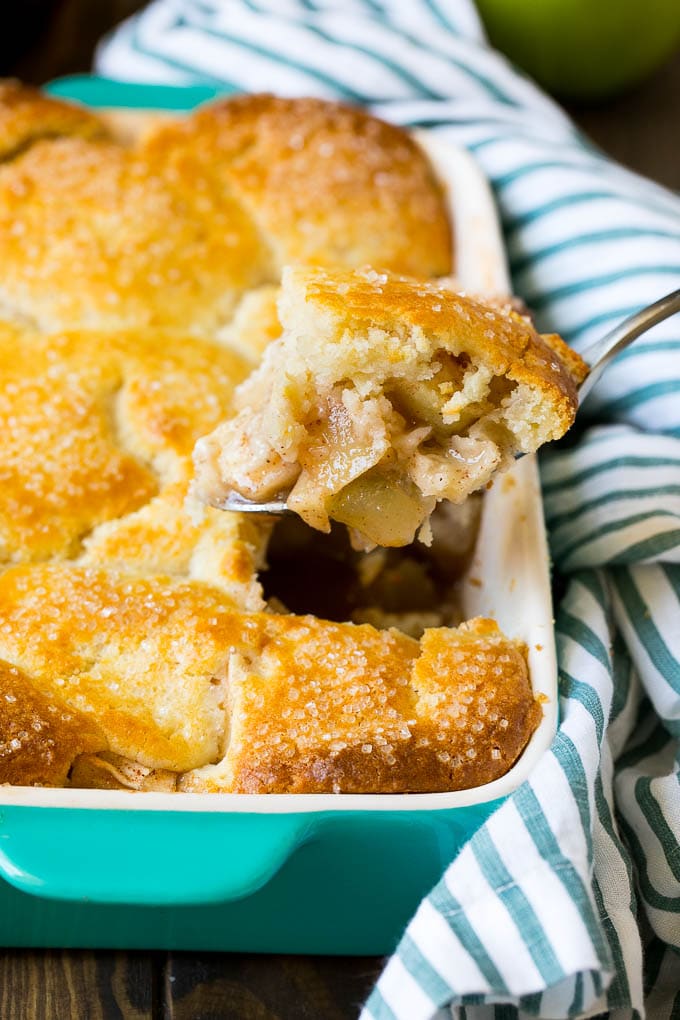 Apple Cobbler Recipe | Apple Dessert #apples #cobbler #dessert #baking #fall #uzhal A spoonful of apple cobbler in the serving dish.