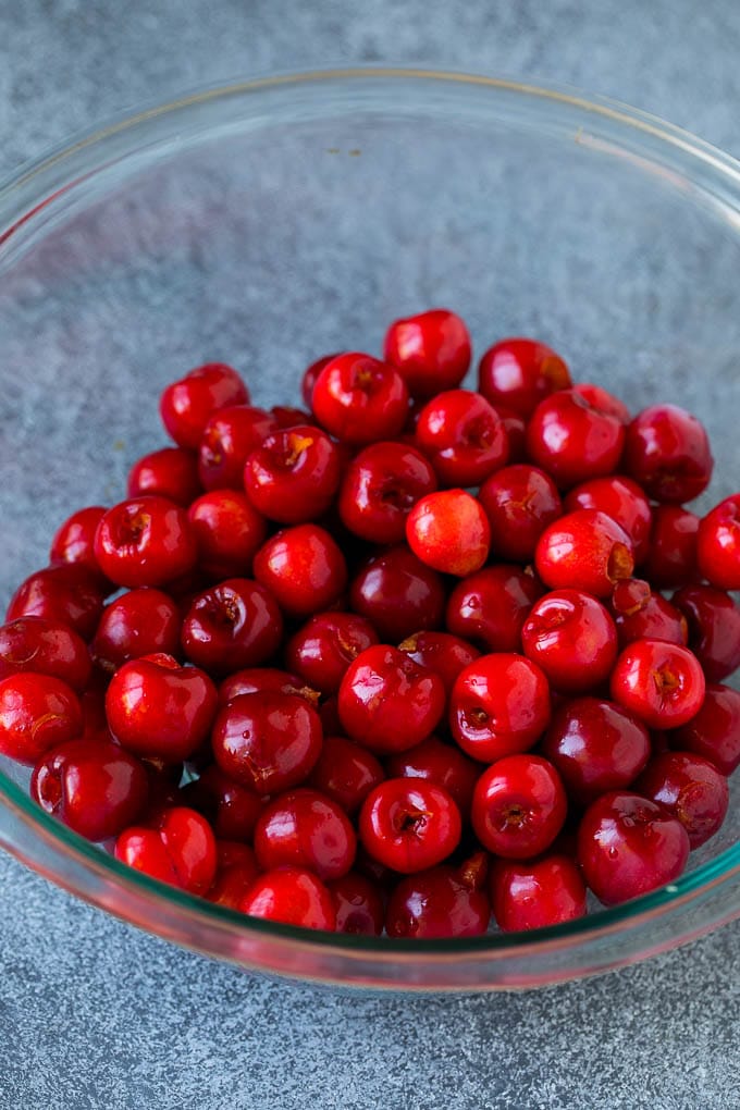 Cherry Pie Filling Recipe #pie #cherries #dessert #sweets #uzhal #summer A bowl of pitted cherries.