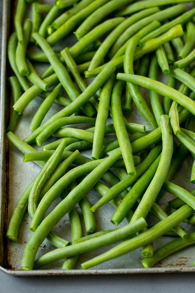 Fried Green Beans Recipe | Green Beans #greenbeans #appetizer #snack #uzhal Green beans on a sheet pan.