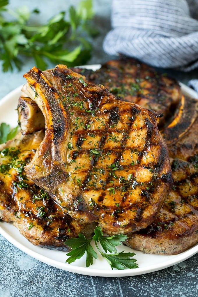 Grilled Pork Chops | Pork Chop Marinade #porkchops #grilling #pork #marinade #dinner #uzhal Grilled pork chops coated in marinade then cooked and garnished with parsley.