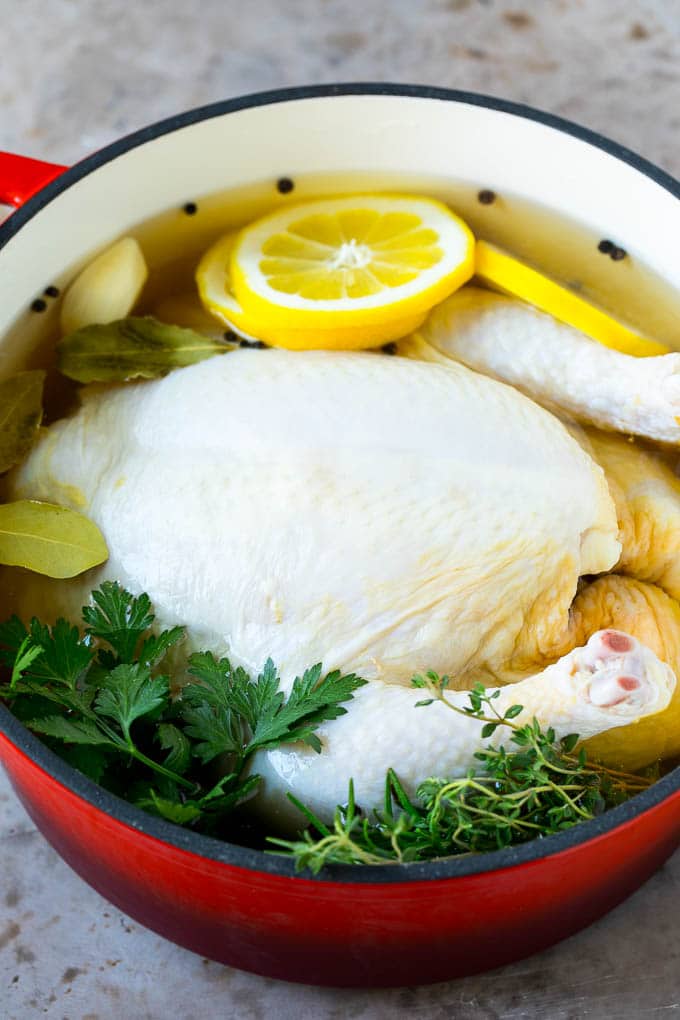 Rotisserie Chicken Recipe | Roasted Chicken #chicken #dinner #uzhal #comfortfood A whole chicken in a pot of brine.