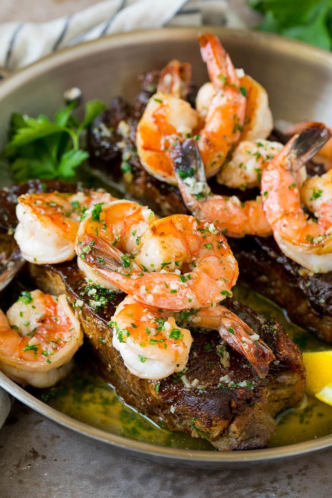 Surf and Turf Recipe | Seared Steak #steak #shrimp #keto #lowcarb #dinner #uzhal Surf and turf with seared strip steaks topped with jumbo shrimp in garlic butter.