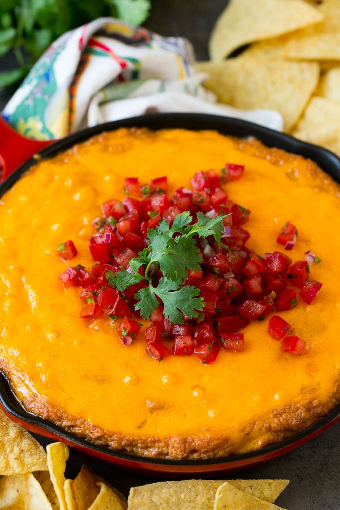 Bean Dip Recipe | Mexican Dip #dip #appetizer #mexicanfood #beans #cheese #uzhal Cheesy Mexican bean dip topped with melted cheese and pico de gallo.
