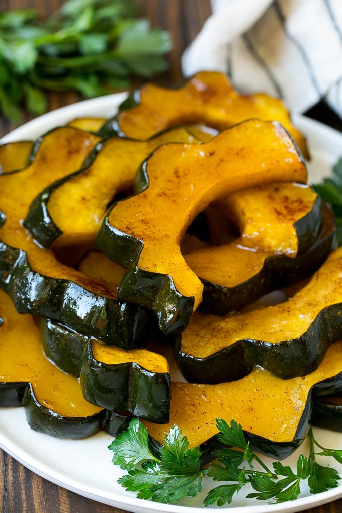 A serving plate of roasted acorn squash.