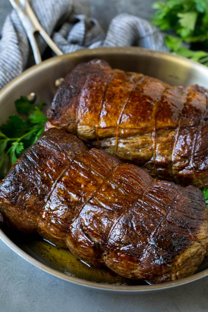 Beef Tenderloin with Garlic Butter #beef #steak #dinner #uzhal Roasted garlic butter beef tenderloin in a pan.
