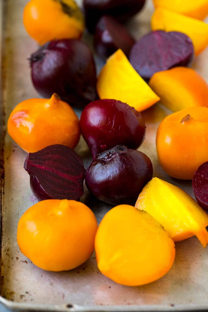 Beet Salad Recipe #beets #avocado #feta #salad #dinner #uzhal Roasted red and yellow beets on a sheet pan.