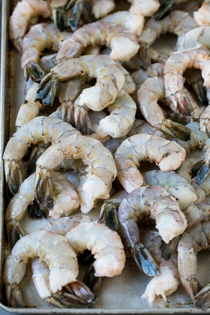 Fried Shrimp Recipe #shrimp #seafood #dinner #appetizer #uzhal Raw shrimp on a sheet pan.