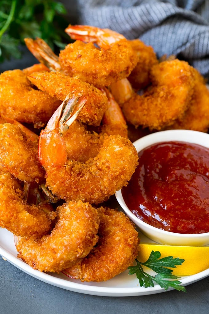 Fried Shrimp Recipe #shrimp #seafood #dinner #appetizer #uzhal A plate of fried shrimp served with cocktail sauce.