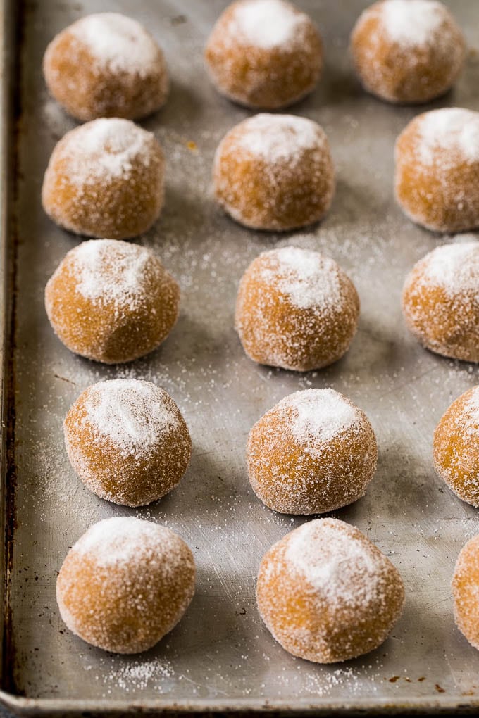 Molasses Cookies Recipe | Spice Cookies #cookies #baking #christmas #dessert #uzhal Balls of cookie dough rolled in sugar on a sheet pan.