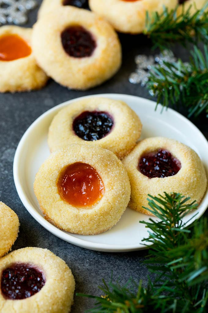 Thumbprint Cookies | Sugar Cookies #cookies #baking #christmas #dessert #uzhal A plate of jam filled thumbprint cookies.