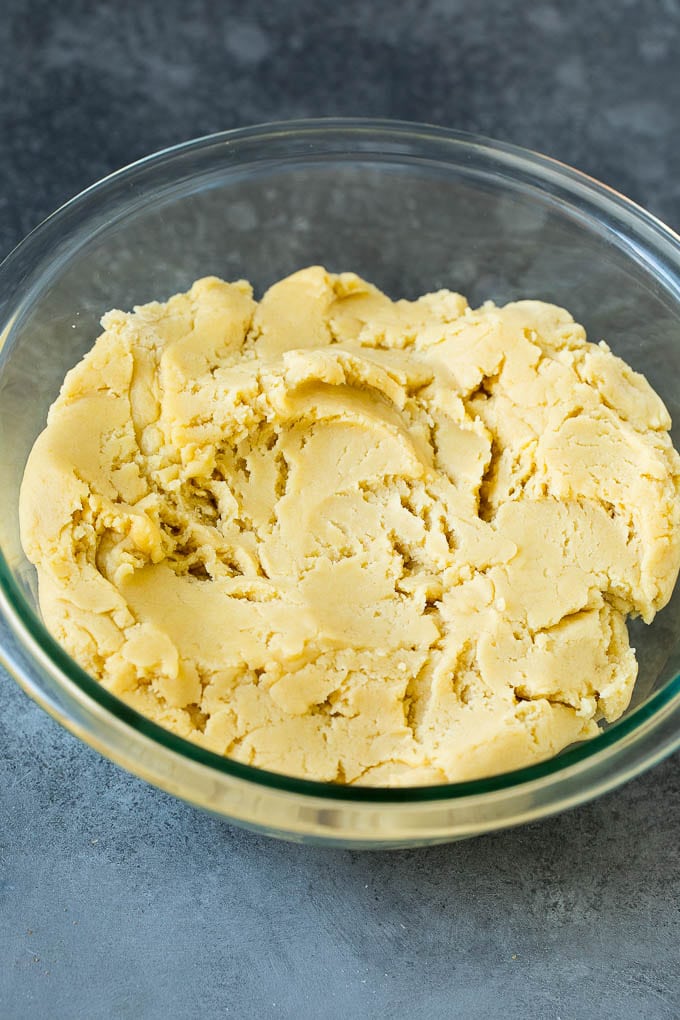 Italian Cookies Recipe | Almond Cookies #cookies #italianfood #frosting #sprinkles #baking #christmas #uzhal Almond cookie dough in a mixing bowl.