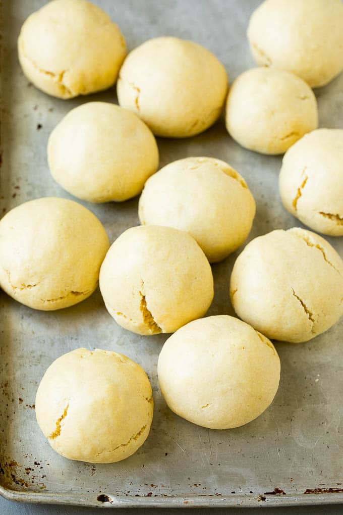 Italian Cookies Recipe | Almond Cookies #cookies #italianfood #frosting #sprinkles #baking #christmas #uzhal Baked almond cookies on a baking sheet.