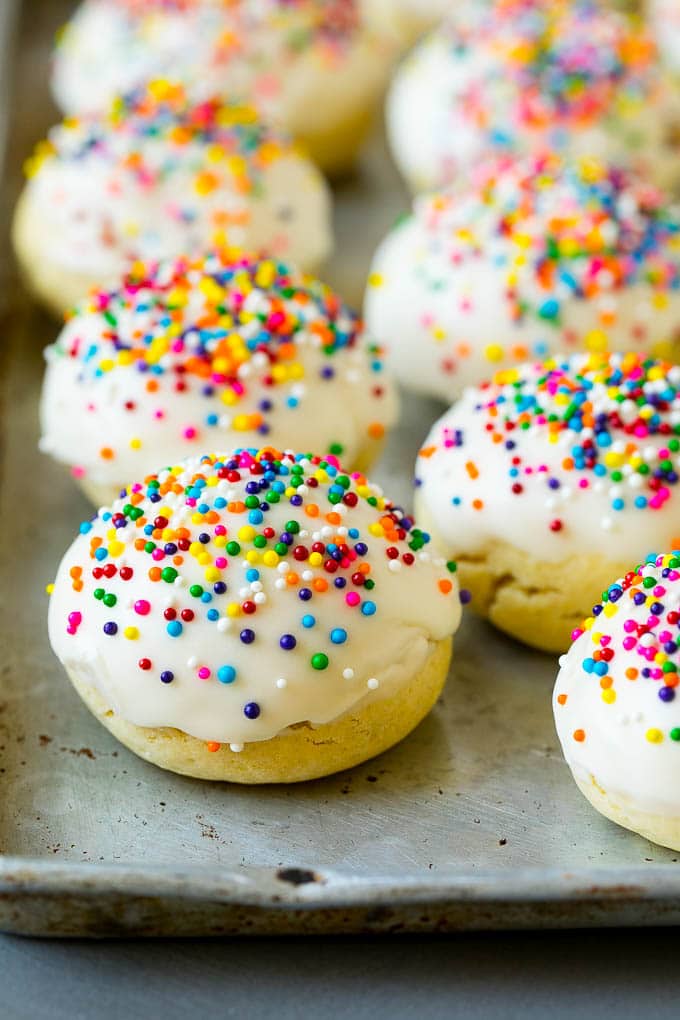 Italian Cookies Recipe | Almond Cookies #cookies #italianfood #frosting #sprinkles #baking #christmas #uzhal Italian cookies covered in frosting and rainbow sprinkles.