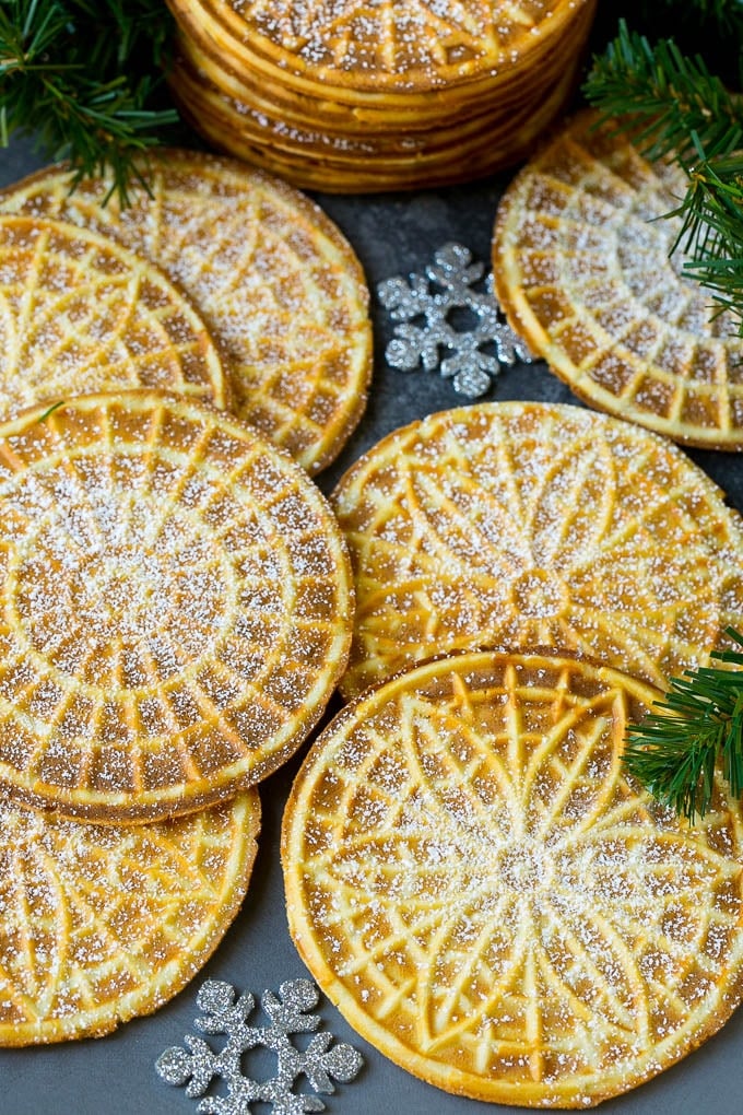 Pizzelle Cookies Recipe #cookies #baking #dessert #christmas #uzhal Pizzelle cookies cooked to golden brown and coated in powdered sugar.