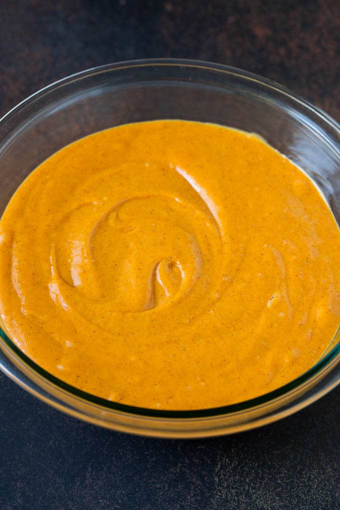 Pumpkin Cake Recipe | Pumpkin Spice Cake #cake #pumpkin #dessert #baking #fall #thanksgiving #uzhal Cake batter in a mixing bowl.