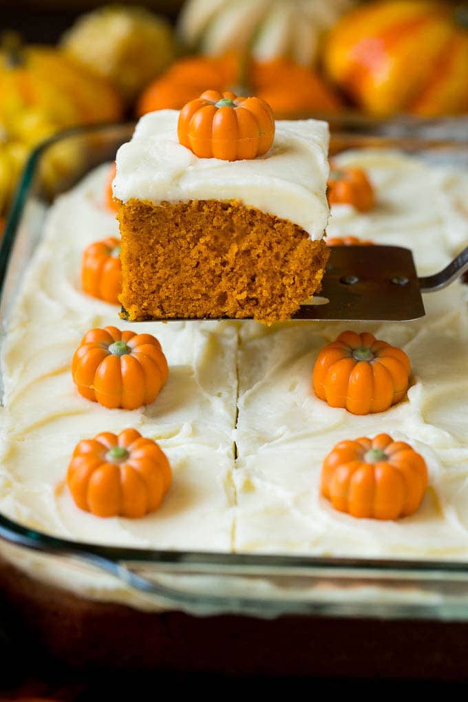 Pumpkin Cake Recipe | Pumpkin Spice Cake #cake #pumpkin #dessert #baking #fall #thanksgiving #uzhal A spatula serving up a slice of pumpkin cake.
