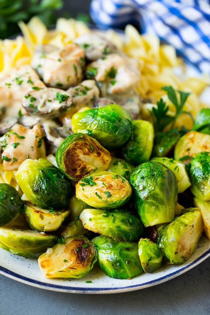 Sauteed Brussels Sprouts Recipe | Brussels Sprouts Side Dish #brusselssprouts #sprouts #veggies #sidedish #garlic #vegetarian #dinner #uzhal Sauteed brussels sprouts served alongside chicken and noodles.