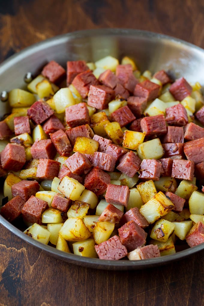 Corned Beef Hash Recipe #hash #cornedbeef #stpatricksday #breakfast #brunch #potatoes #uzhal Corned beef and potatoes cooked together in a pan.