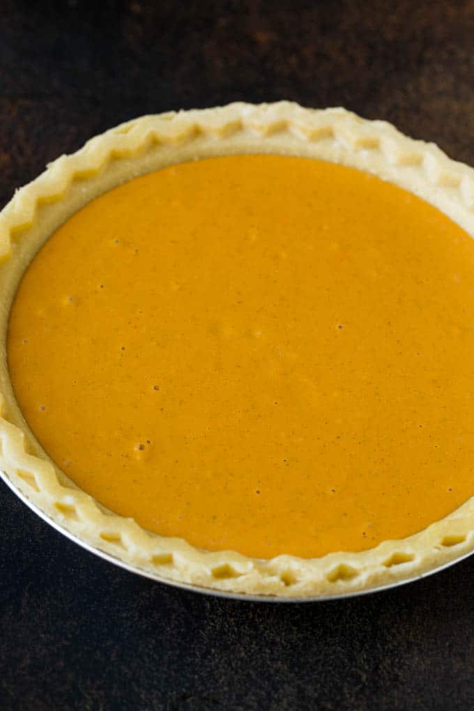 Homemade Pumpkin Pie Recipe | Pumpkin Pie #pie #pumpkin #baking #thanksgiving #fall #dessert #uzhal Pie filling inside a pie crust.