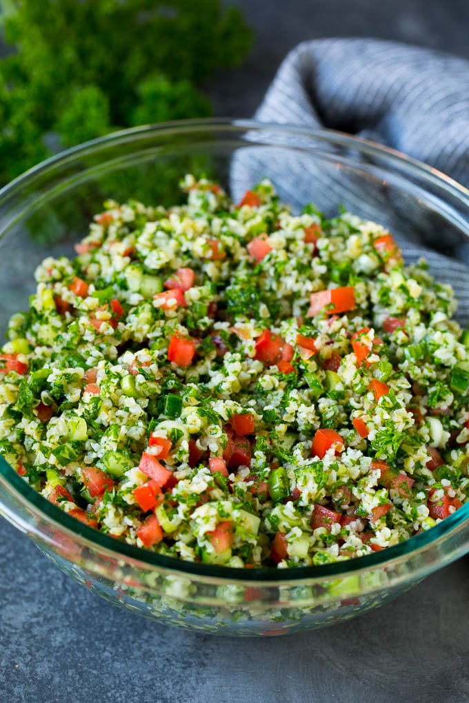 Tabbouleh Salad | Tabouli #salad #wheat #tomatoes #cucumber #healthy #sidedish #dinner #uzhal A serving bowl filled with tabbouleh salad.