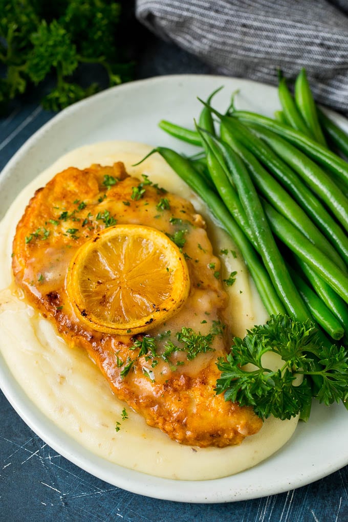 Chicken Francese Recipe #chicken #lemon #dinner #uzhal Chicken francese served over mashed potatoes with green beans.
