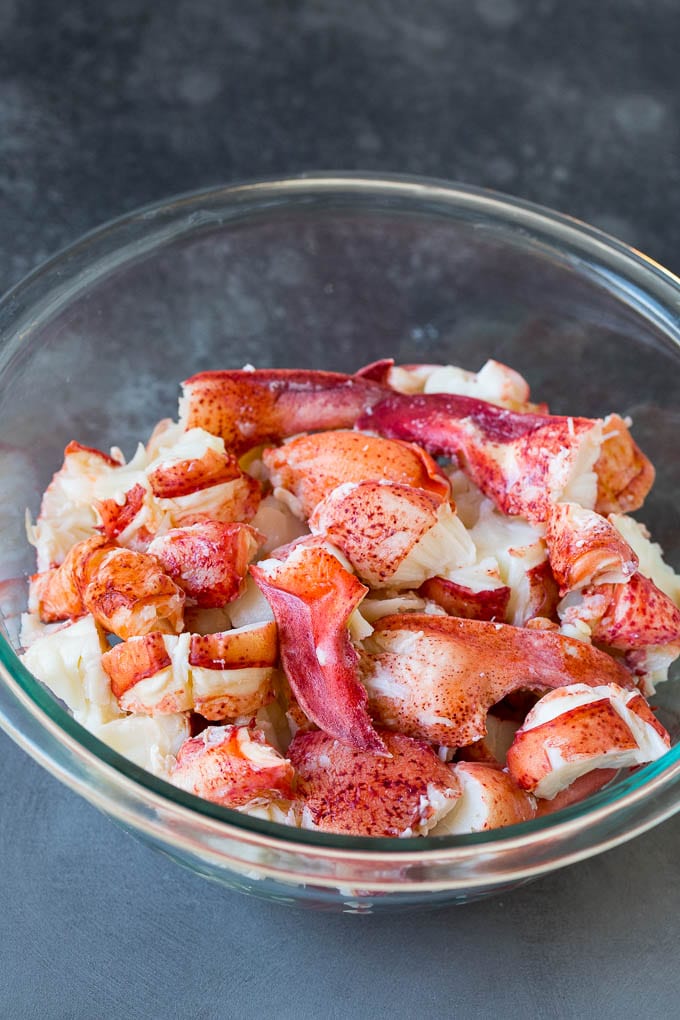 Lobster rolls stuffed with creamy lobster salad in a toasted bun. #lobster #uzhal Chunks of lobster meat in a bowl.