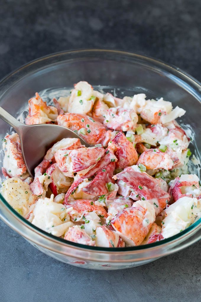 Lobster rolls stuffed with creamy lobster salad in a toasted bun. #lobster #uzhal Lobster salad in a bowl in a creamy dressing.