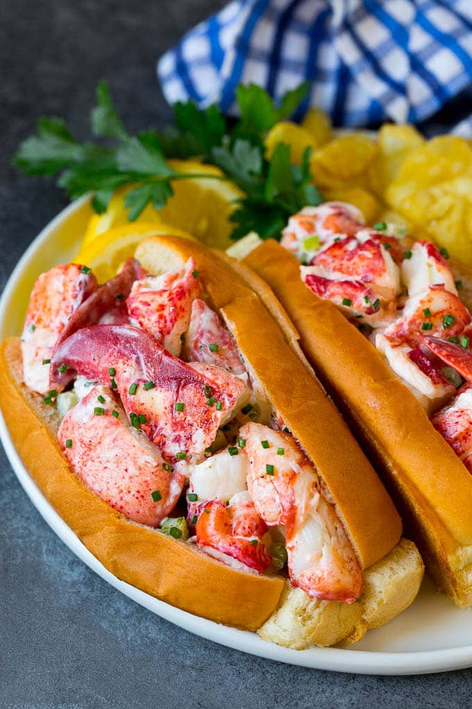 Lobster rolls stuffed with creamy lobster salad in a toasted bun. #lobster #uzhal Lobster roll with chunks of fresh lobster meat in a buttered and toasted bun.