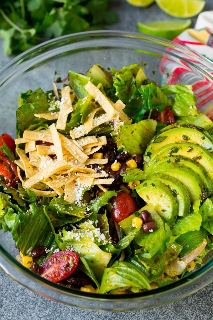 Mexican Salad Recipe #salad #corn #beans #avocado #tomatoes #uzhal Mexican salad with lettuce, corn, beans and tomato, tossed in a lime dressing.