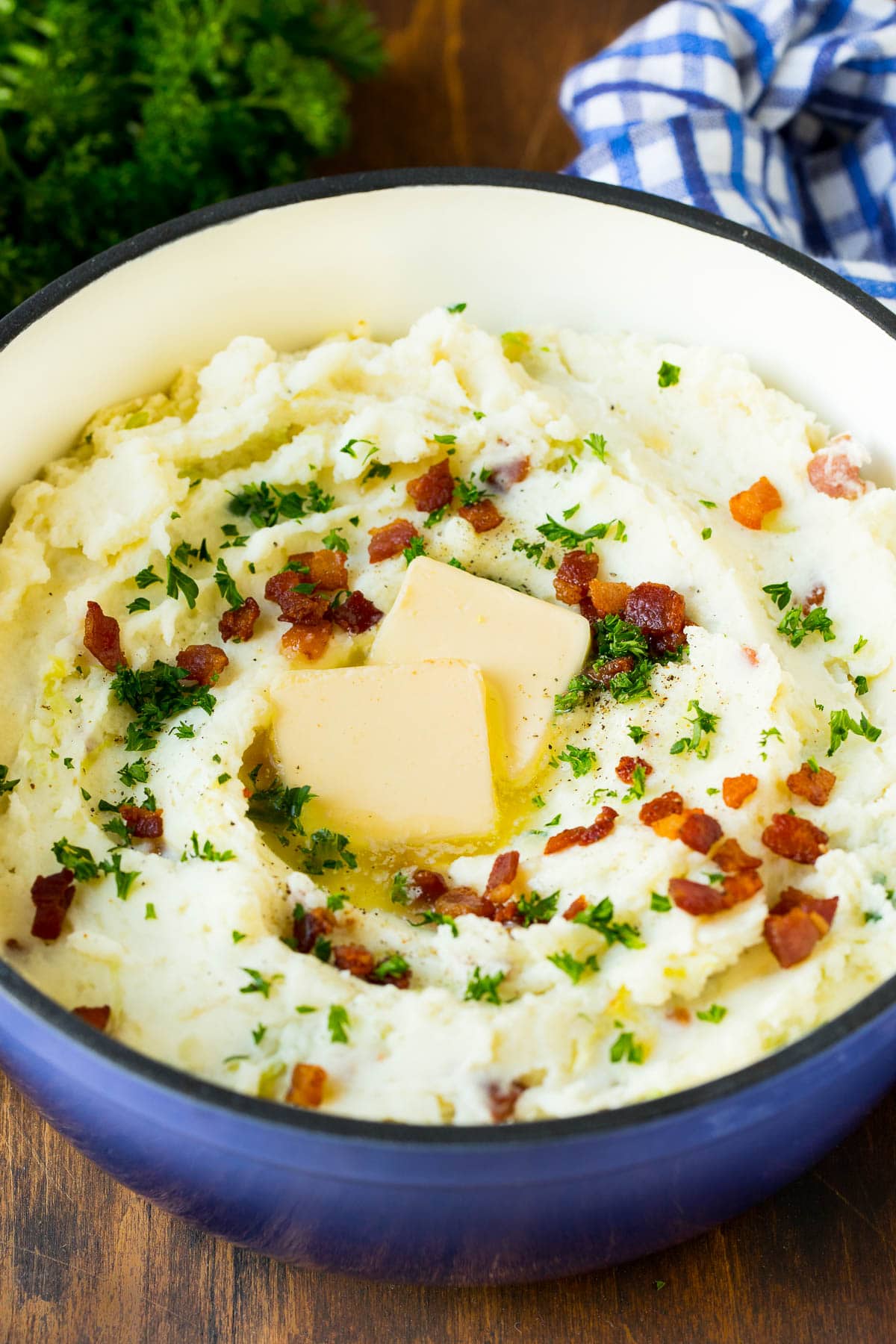 Colcannon Recipe | Mashed Potatoes #potatoes #cabbage #bacon #sidedish #stpatricksday #dinner #uzhal A pot of colcannon garnished with butter, bacon and herbs.
