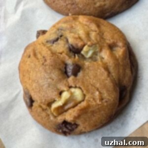 Chocolate Chip Cookies made with a scoopable cookie dough containing shortening and tub style margarine, displaying a perfect texture.